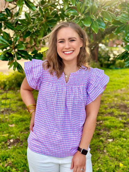 Gingham print + smocking detail and ruffled sleeves = perfection! The Annalise top by Washco Apparel is a great top for the Spring and Summer seasons. The top includes beautiful smocking detail and ruffed sleeves with a v-notch neckline.