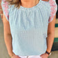 The Audrey Top by Washco Apparel is a beautiful mint green and white gingham print with a pop of pink embroidery design. We love the gathered neckline and ruffled flair sleeves. Pair the Audrey Top with a cardigan or cute denim jacket and make it a great top for year round!