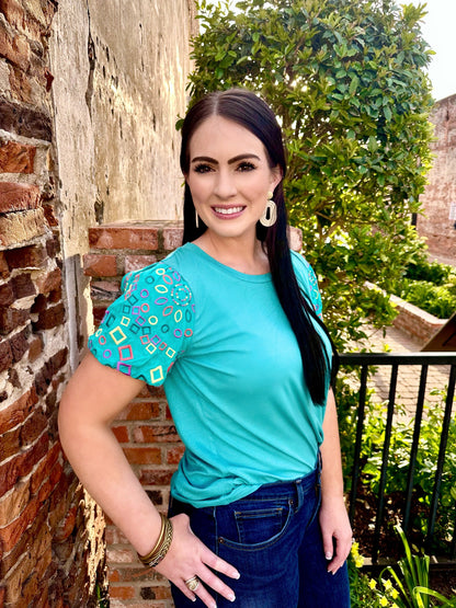 The Blair Top by Washco Apparel is soft, comfortable and cute for any occasion. We love the embroidered statement sleeves and that this material has stretch!