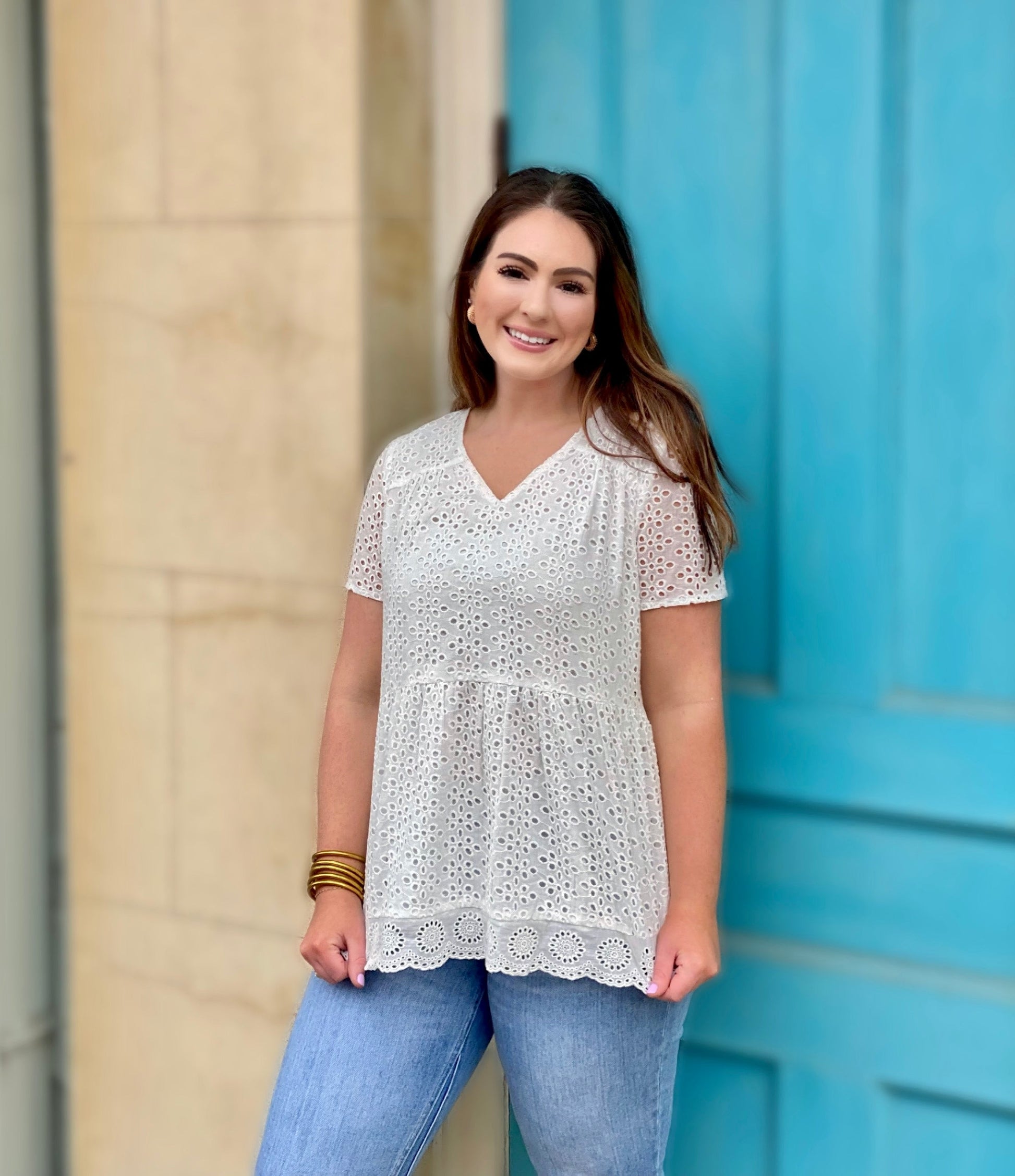 The Britney Top by Washco Apparel is a gorgeous white eyelet babydoll top. This top is lined with a thin cotton lining, so you will not need an undershirt and is breathable for all of your Spring and Summer events.