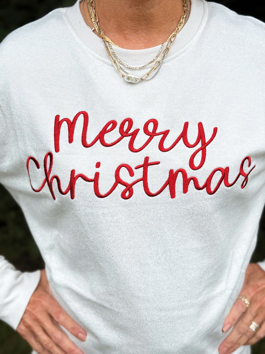 White sweater with 'Merry Christmas' in red text
