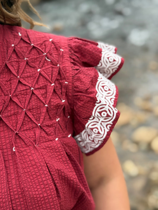 maroon and white textured top with embroidery detail by Washco Apparel