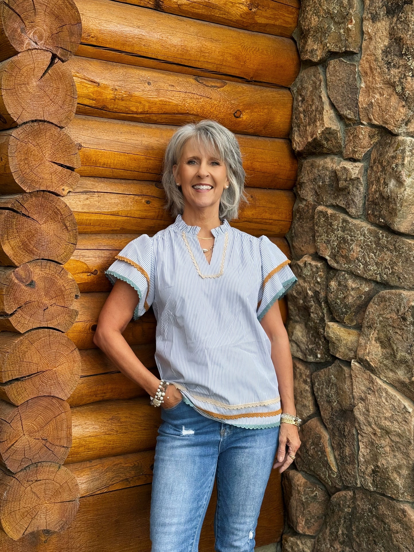 The Judd Top includes blue and white stripes with lace detailing