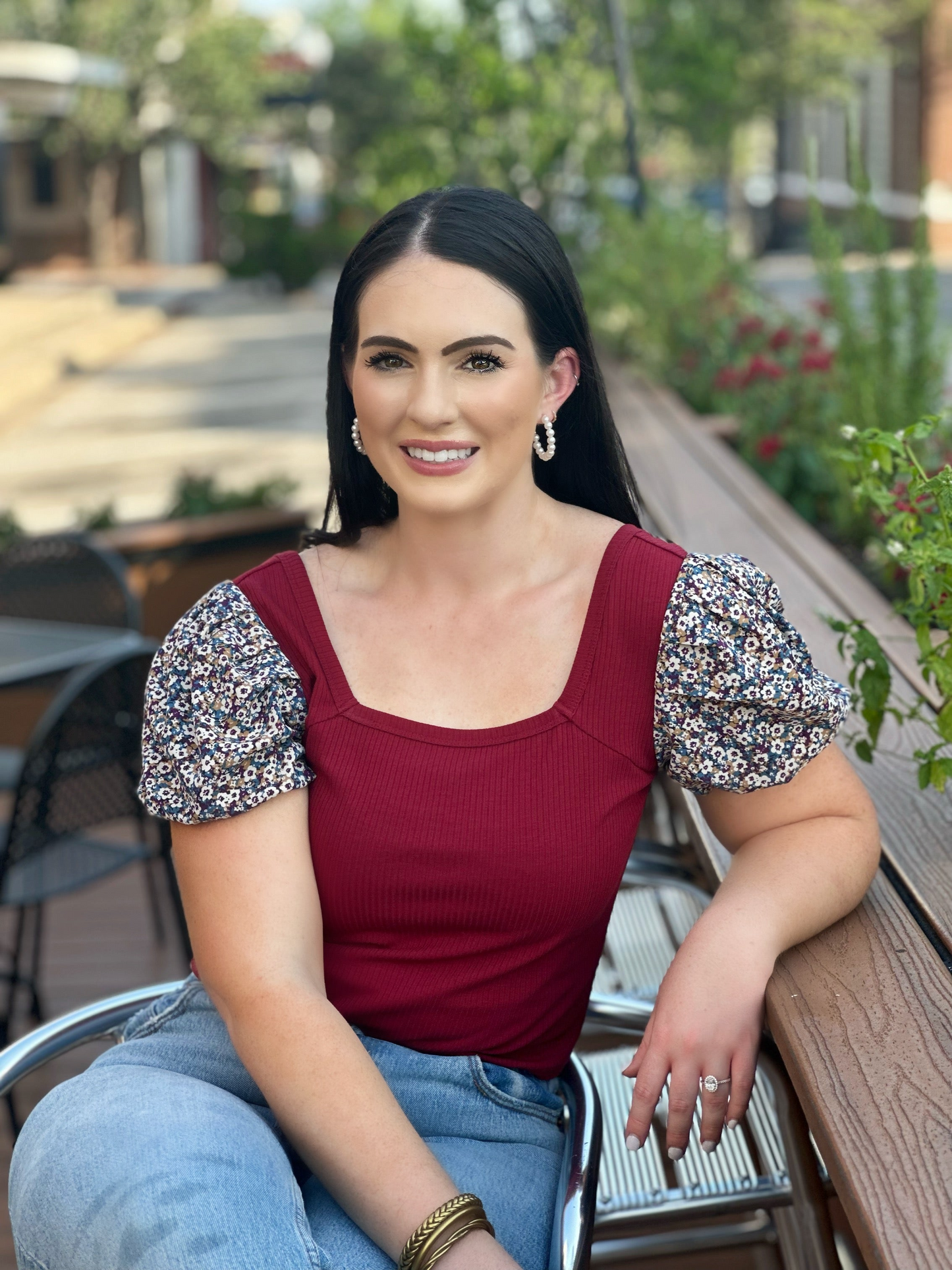 Make a fashion statement with the Abigail top by Washco Apparel! This adorable cropped top has floral sleeves and offers a flattering fit. The top hits right at your high waisted jean line, making it fun and flirty!