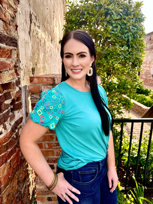Order Washco Apparel Wholesale - The Blair Top. The Blair Top by Washco Apparel is soft, comfortable and cute for any occasion. We love the embroidered statement sleeves and that this material has stretch!