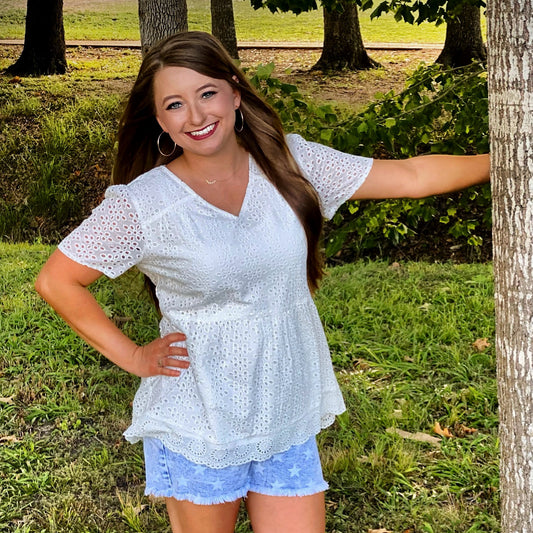 The Britney Top by Washco Apparel is a gorgeous white eyelet babydoll top. This top is lined with a thin cotton lining, so you will not need an undershirt and is breathable for all of your Spring and Summer events.