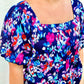 The Chandler Top by Washco Apparel is a bright, bold and multi-print baby doll top with puffed sleeves. The top includes a square neckline and smocking detail (with stretch) across the back.