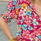 Order Washco Apparel Wholesale - The Connie Top. A print we couldn’t resist! The Connie top by Washco Apparel is a beautiful floral top with short sleeves and smocked detailing around the cuff. This top is great for any occasion!