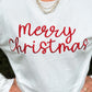 White sweater with 'Merry Christmas' in red text