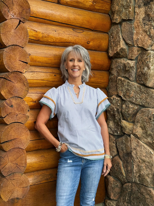 The Judd Top includes blue and white stripes with lace detailing